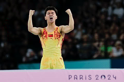 Wang Zisai of China competes during men's trampoline finals